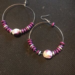 Purple hoop earrings.